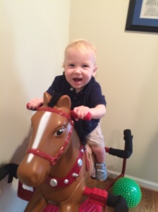 Riding on his horse Benny....no fear Daddy is standing by:)